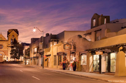 Dawn's glow warms La Fonda's historic entrance on San Francisco Street 